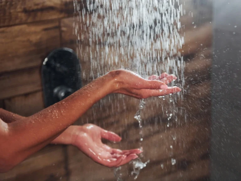 woman-catching-water-from-tankless-water-heater