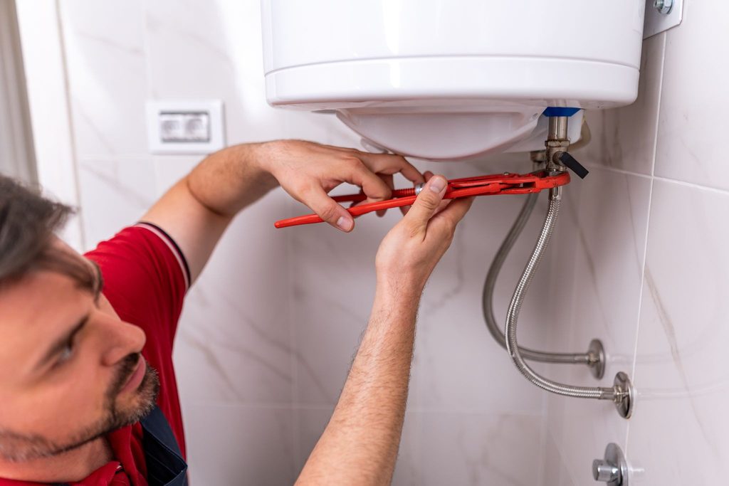plumber-installing-tankless-water-heater